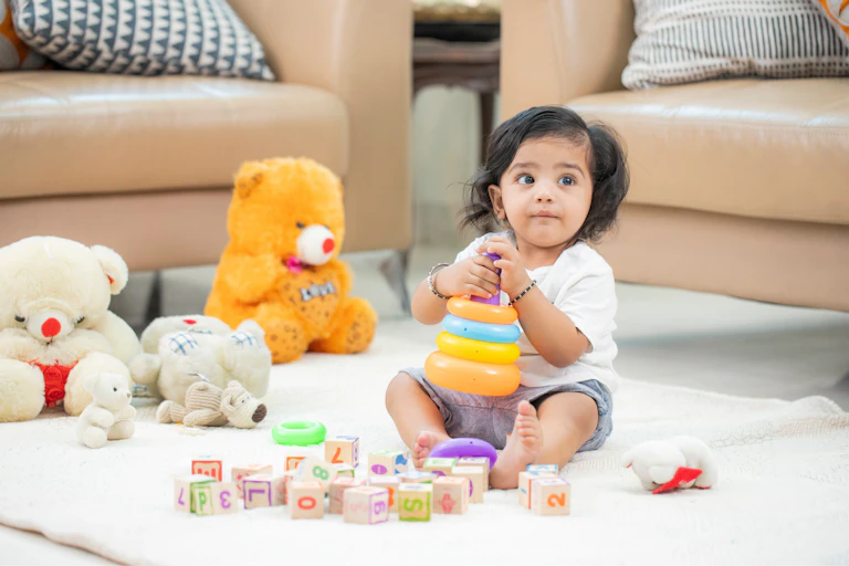 Small child playing with toys