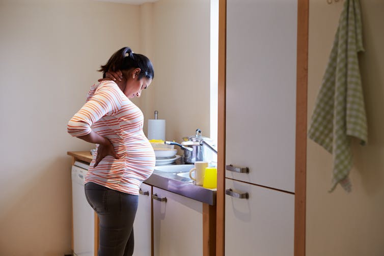Pregnant woman in kitchen