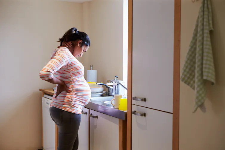 Pregnant woman in kitchen
