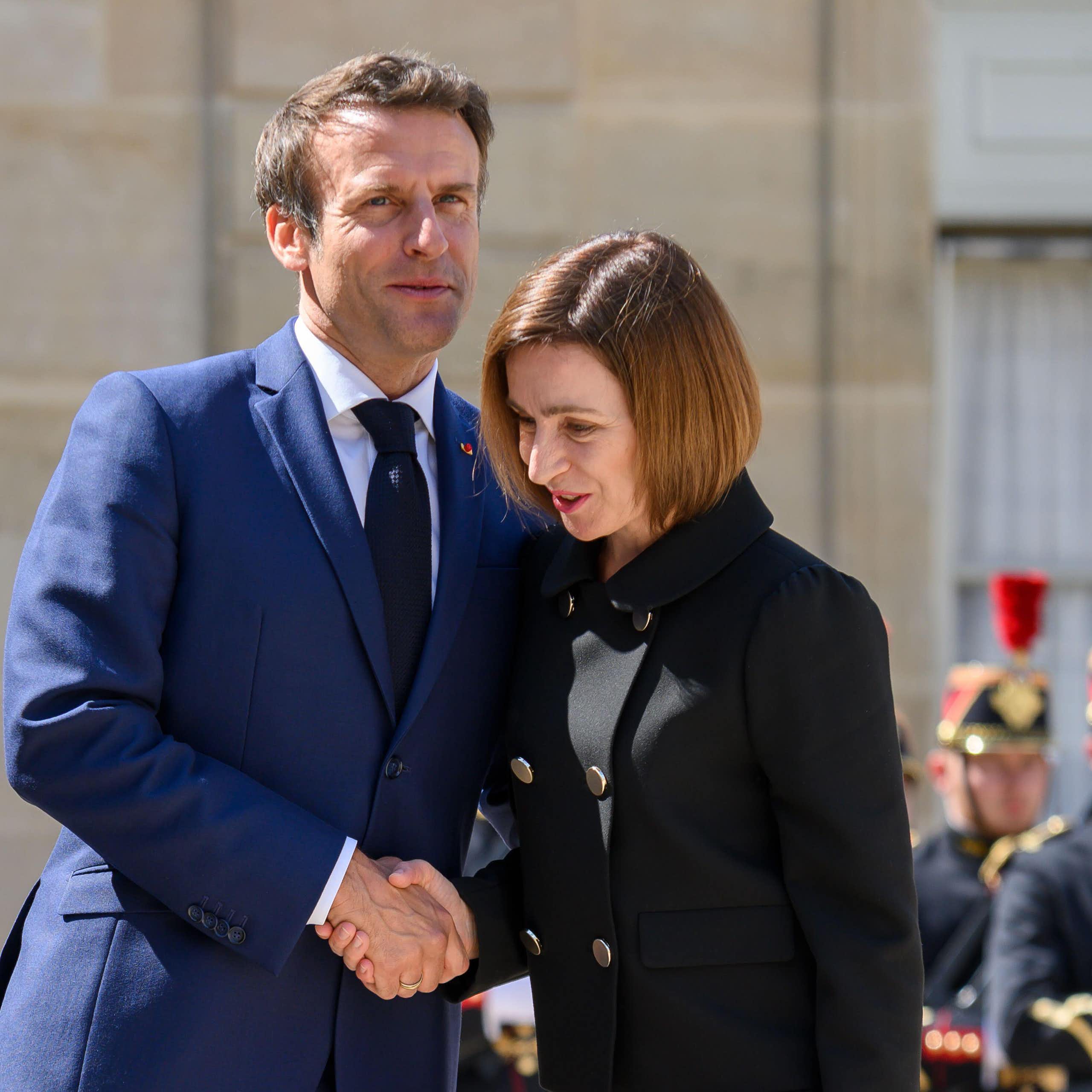 Moldova 's president shakes hands with France's Emmanuel Macron on a visit to Paris in 2022.