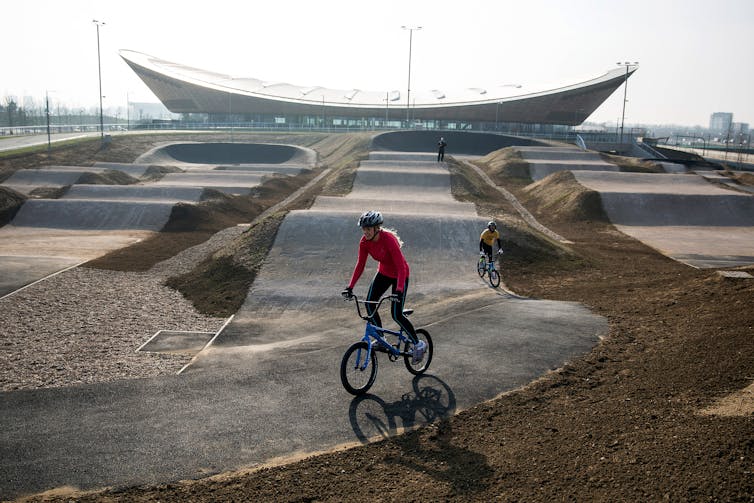 Cyclists ride the BMX track at the Velopark, formerly the cycling venue for the London 2012 Games.