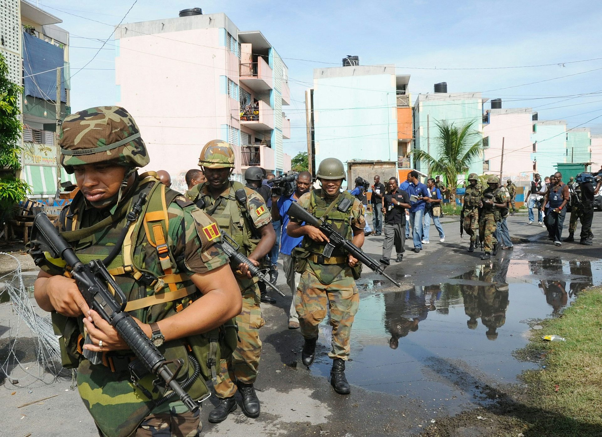Soldiers patrol Tivoli Gardens in Kingston.