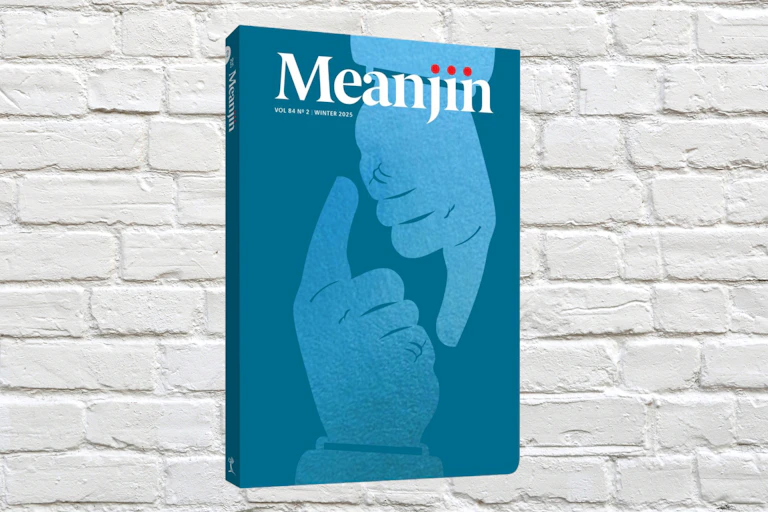Meanjin cover superimposed against a whitewashed brick wall