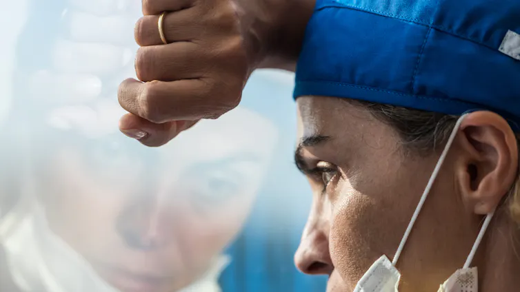 A medical worker looks dejected.
