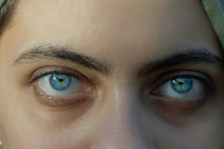 A person with bright blue eyes.
