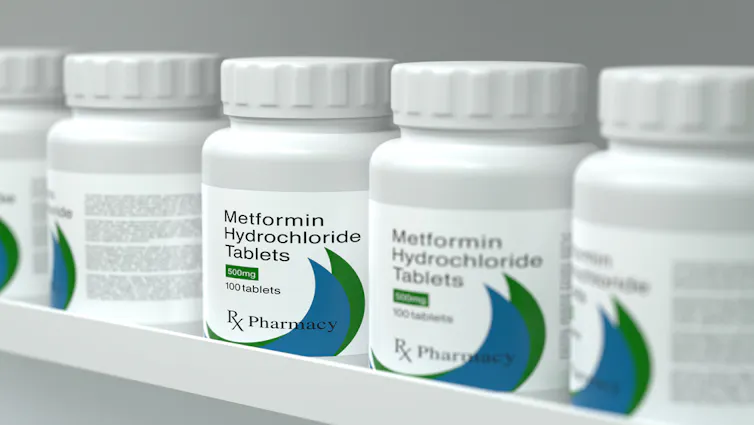 Bottles of metformin on a shelf.
