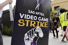 A sign says video game strike.
