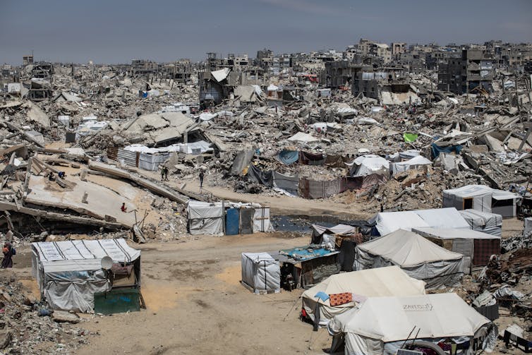 Donald Trump’s imaginative and prescient for Gaza’s long term: what a leaked plan tells us about US regional technique 1 Tents and makeshift shelters at Jabalia refugee camp north of Gaza City, May 2025.