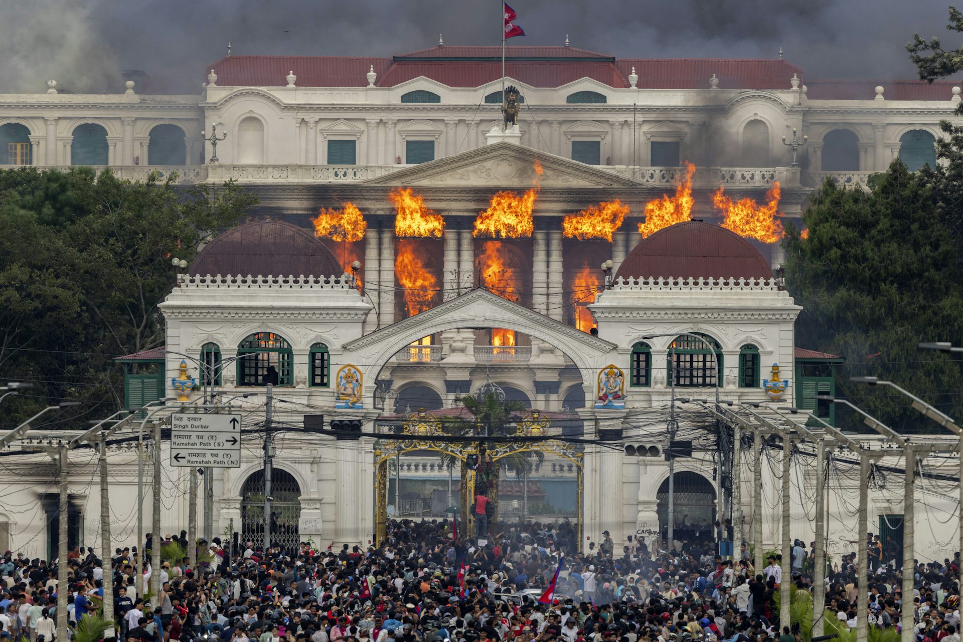 Fire and smoke rise from a government building in Kathmandu.
