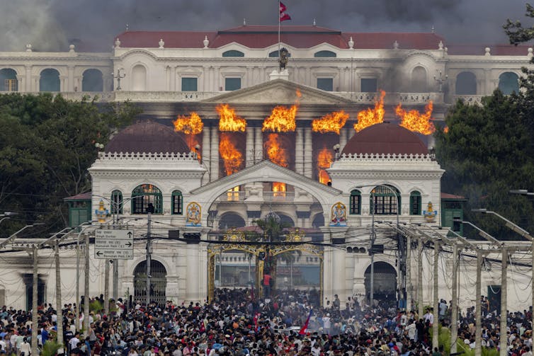 Nepal’s social media ban sparks fatal protests, however deeper grievances gas the fireplace 1 Fire and smoke rise from a government building in Kathmandu.
