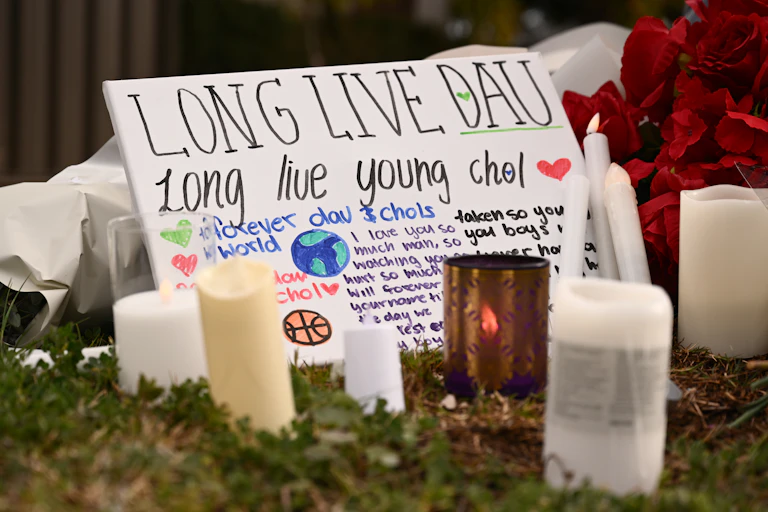 Tributes at the scene of a fatal stabbing in Cobblebank, Victoria.