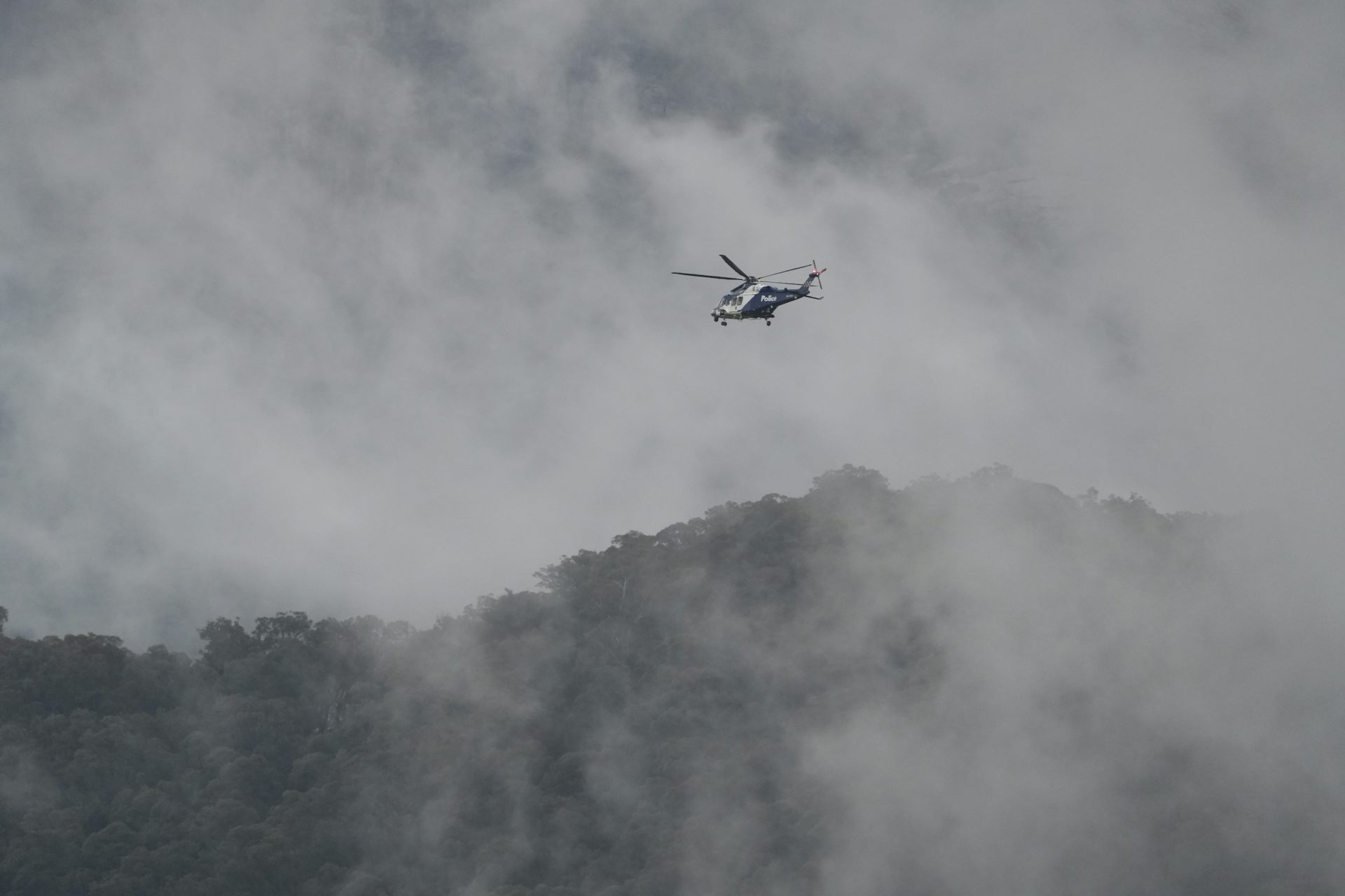 Helicopter in mountains. 