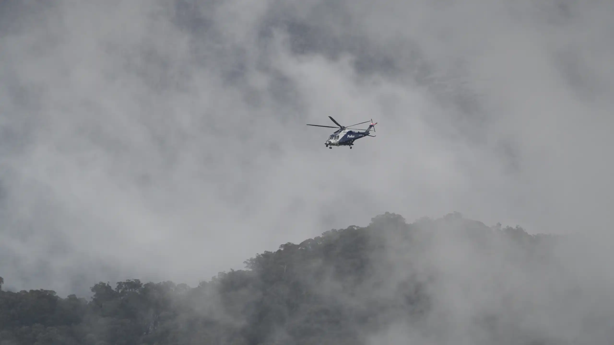 Helicopter in mountains.