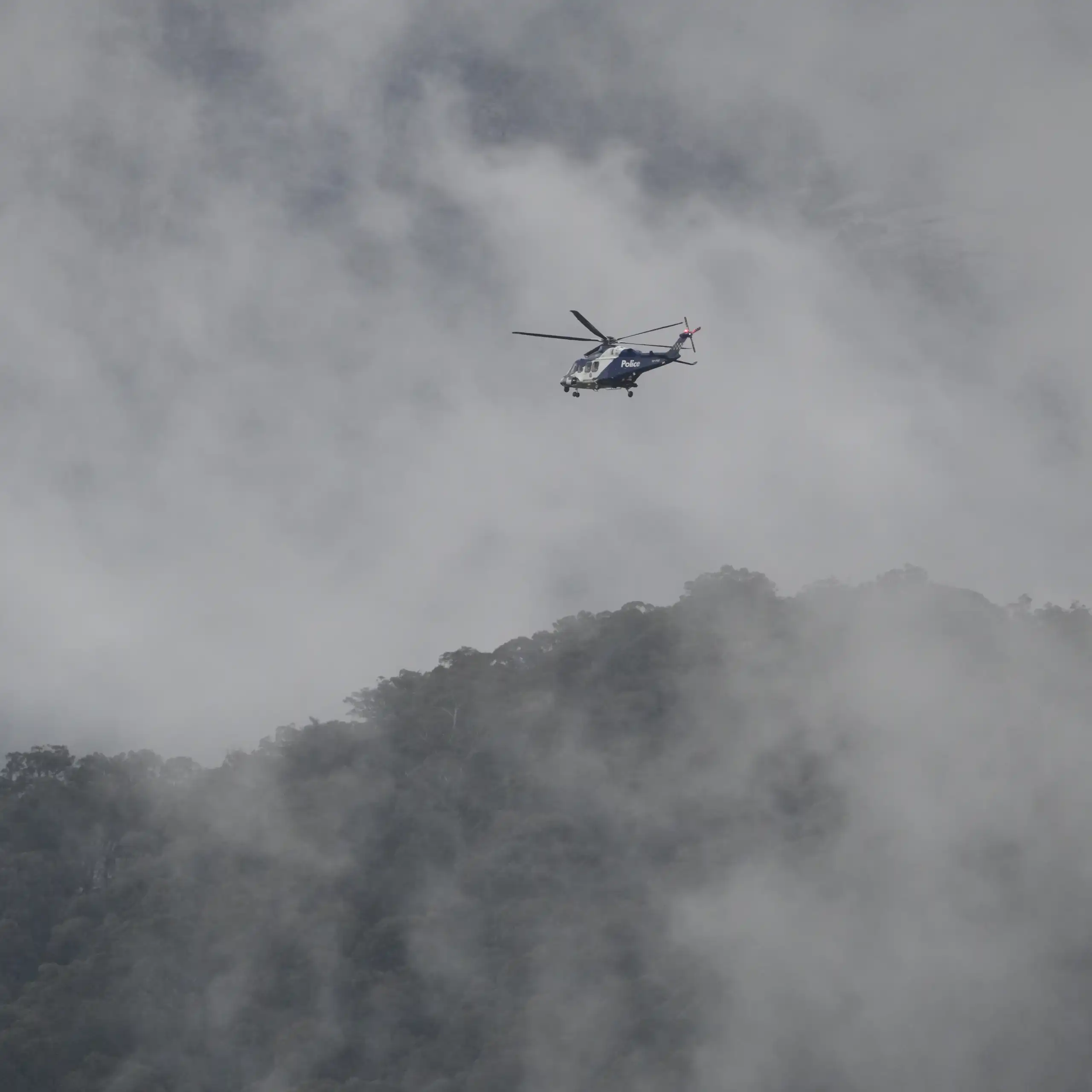 Helicopter in mountains.