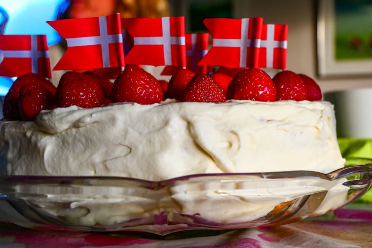 A cake decorated with Danish flags.