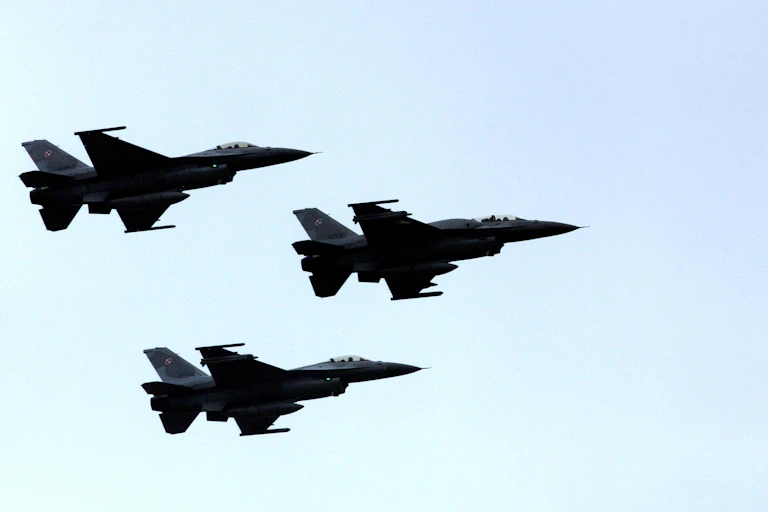 Polish F16 fighter jets in flight.