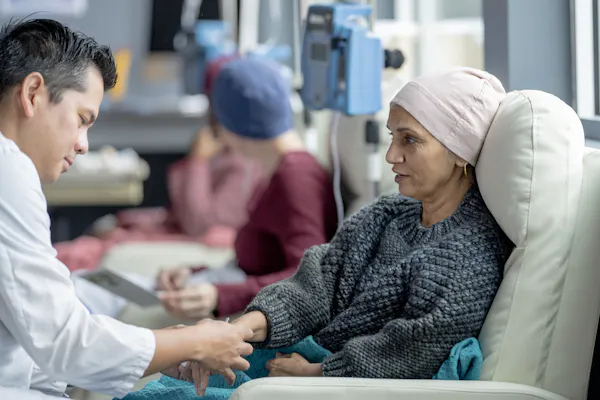 A cancer patient receives chemotherapy in a clinic