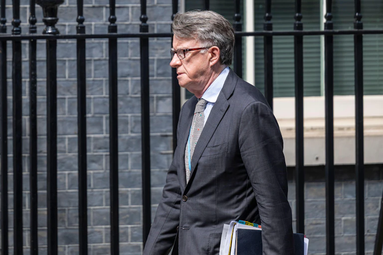 Peter Mandelson walking along Downing Street.