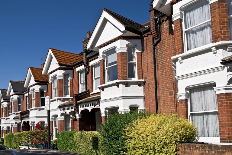 row of red-brick terraced homes in the uk