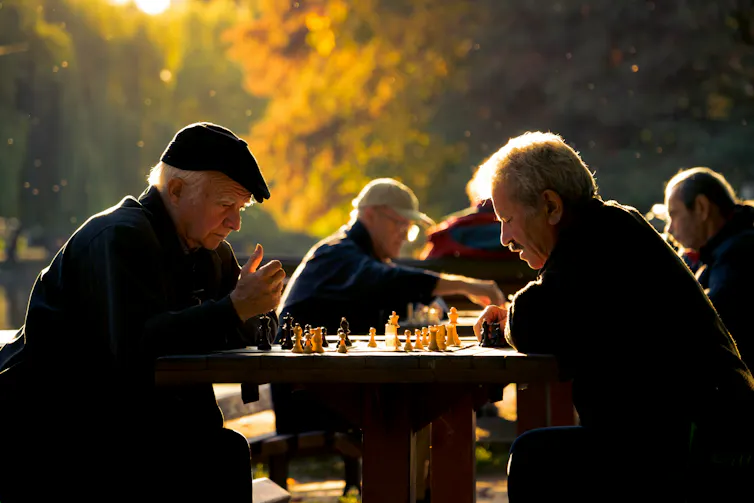 People playing chess outdoors