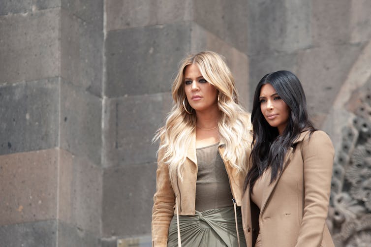 Khloé Kardashian with her sister Kim.