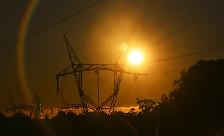 Electricity tower and setting sun