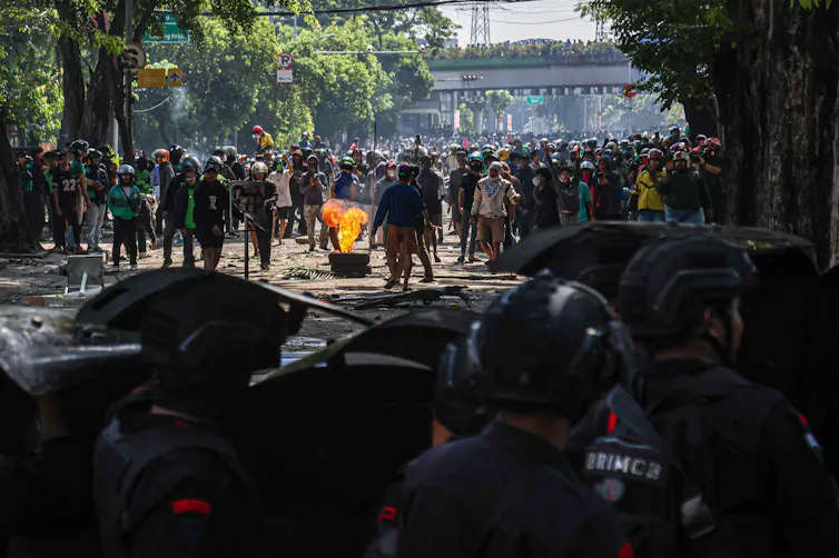 The Indonesian Police's Mobile Brigade Unit spark public outcry after an officer runs over a civilian, killing him.