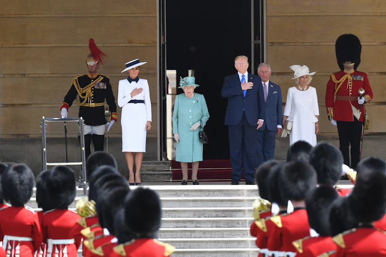 US President Donald Trump and his wife Melania stand with Queen Elizabeth II , Prince Charles the Prince of Wales and Camilla, Duchess of Cornwall on the steps of Buckingham Palace.