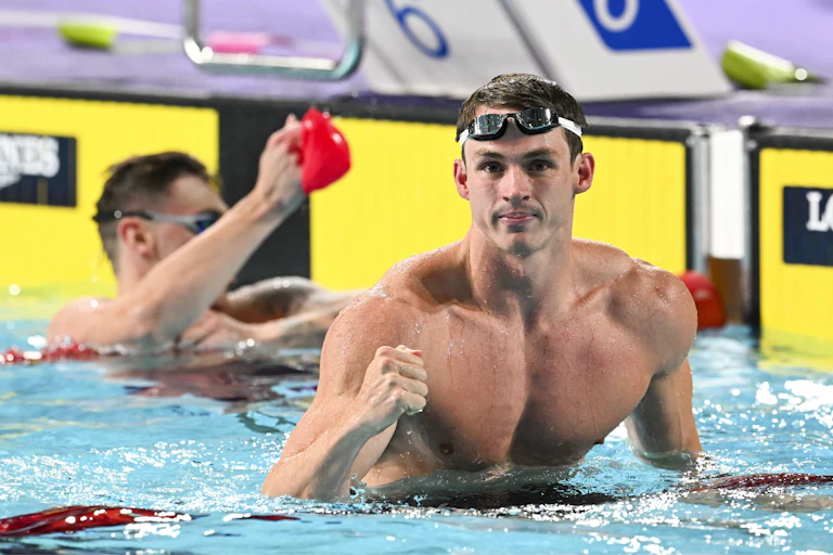 british swimmer ben proud in the pool at the end of a race.