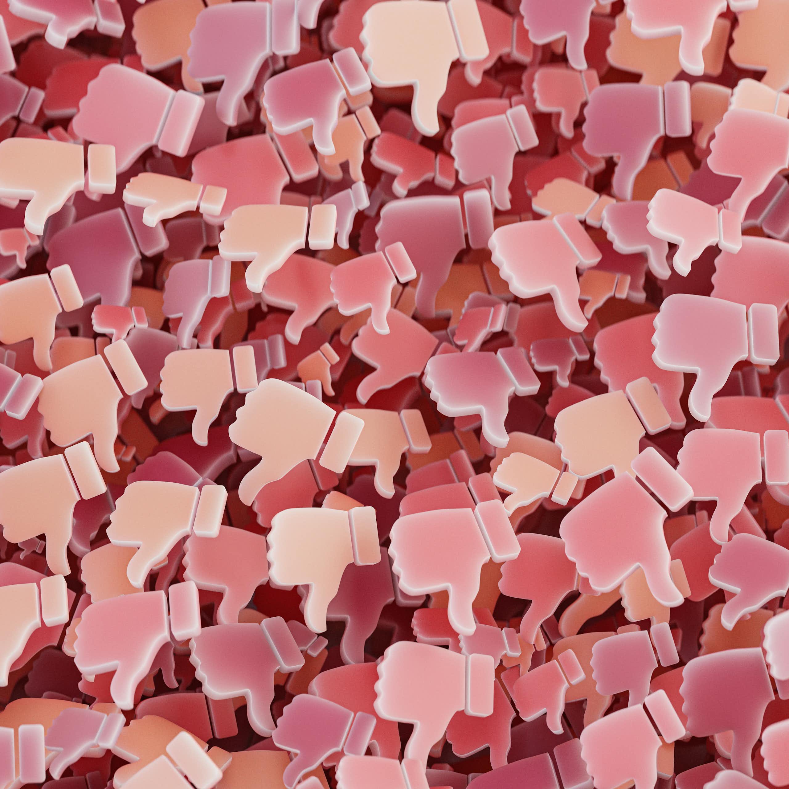 A background of pink social media thumbs-down.