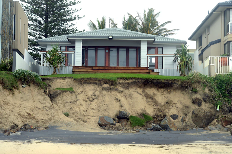 Beach erosion seen threatening homes on the Gold Coast.