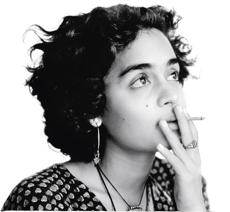 A young woman smoking a cigarette.