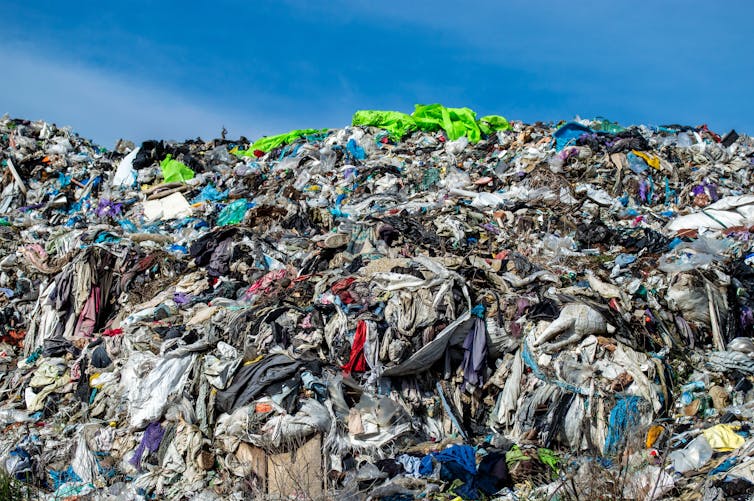 Huge pile of discarded clothing and fabrics.