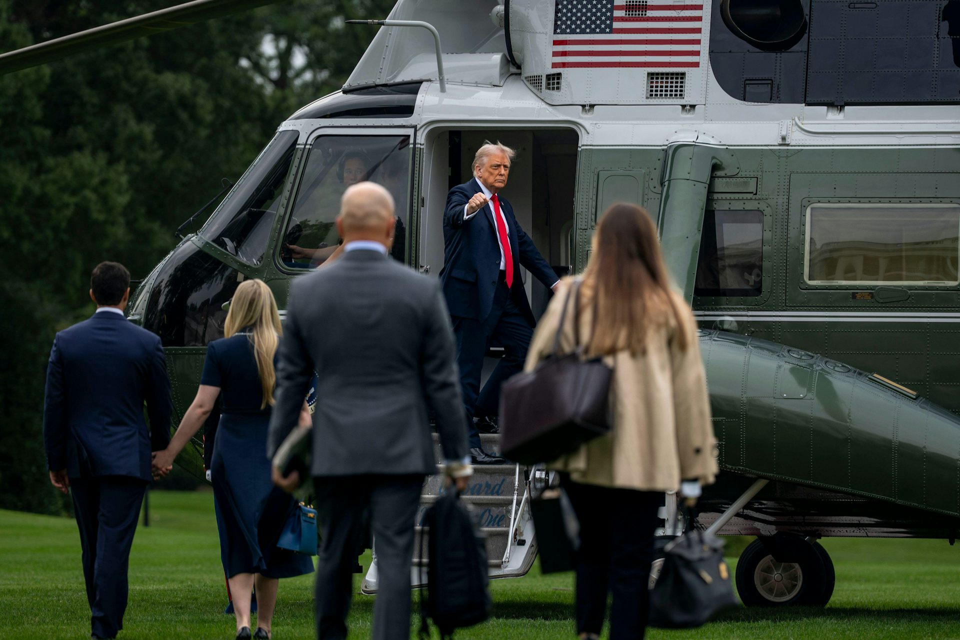 Donald Trump getting into a helicopter.