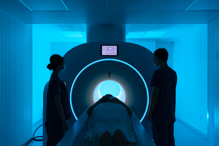 Nurse preparing a patient for hospital MRI scan