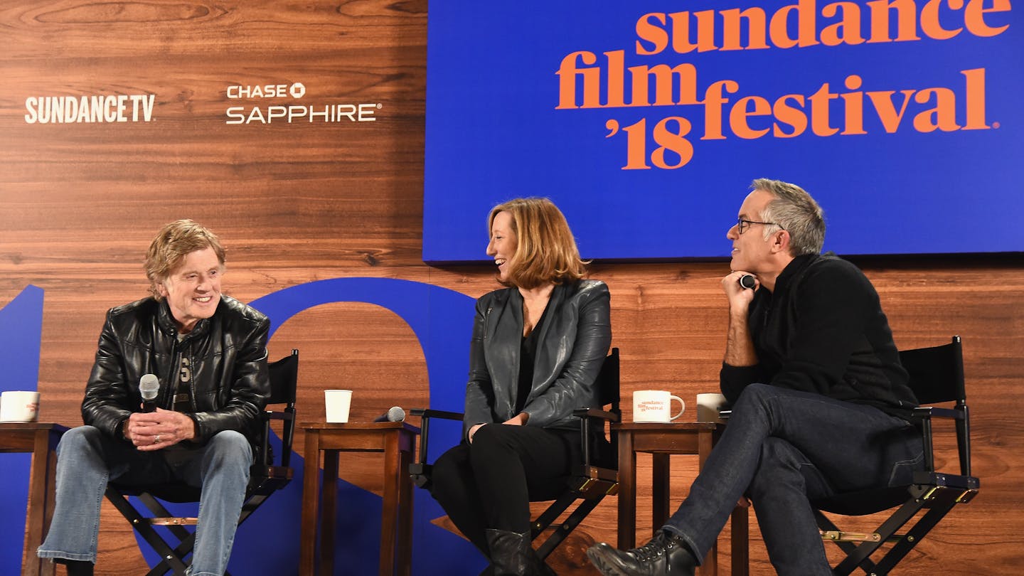 Three people on a stage