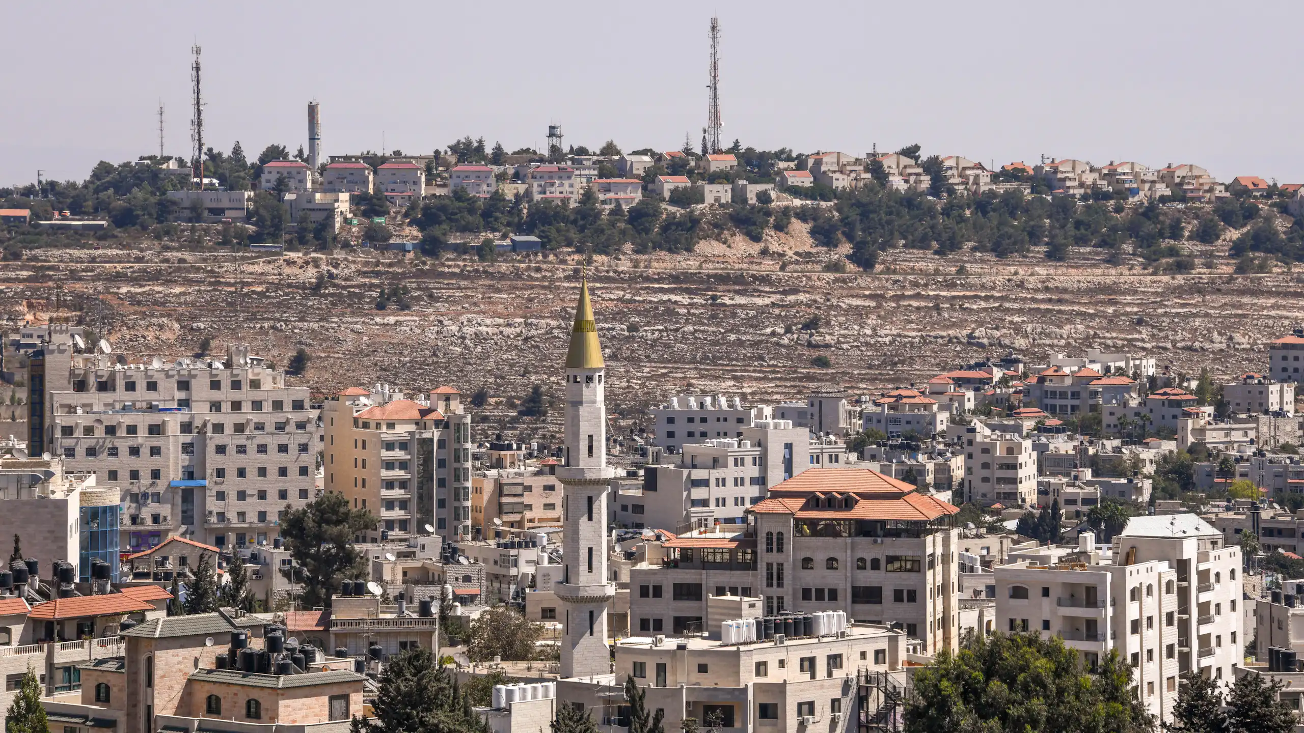 Aerial view of Ramallah in the West Bank with Israeli settlement overlooking it.