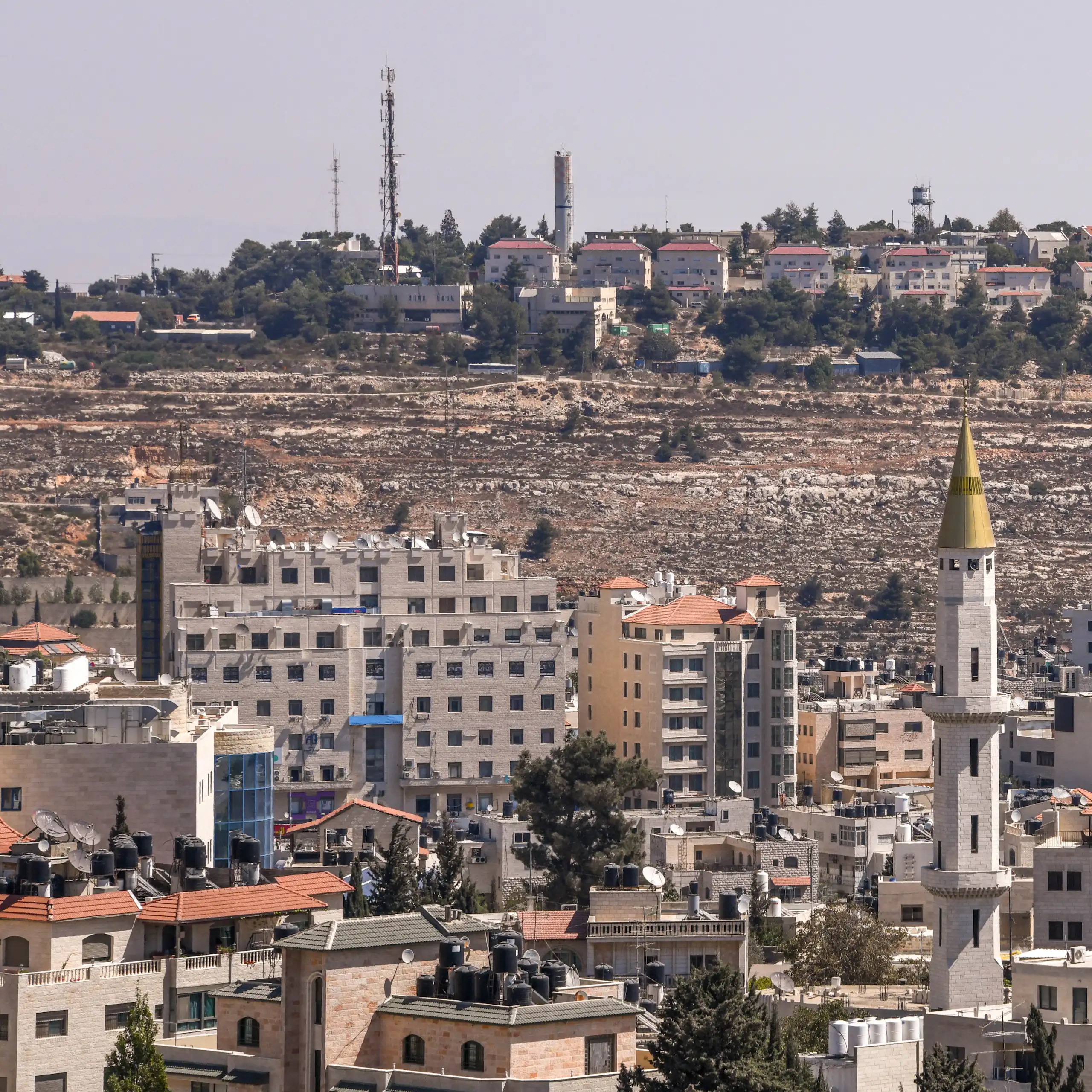 Aerial view of Ramallah in the West Bank with Israeli settlement overlooking it.