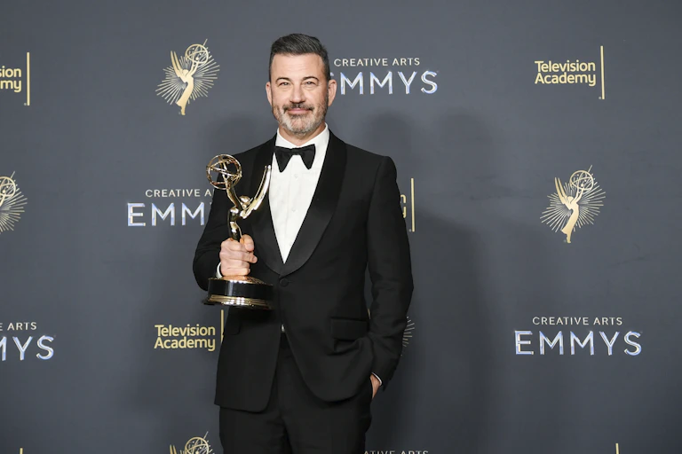 Jimmy Kimmel holding an Emmy award