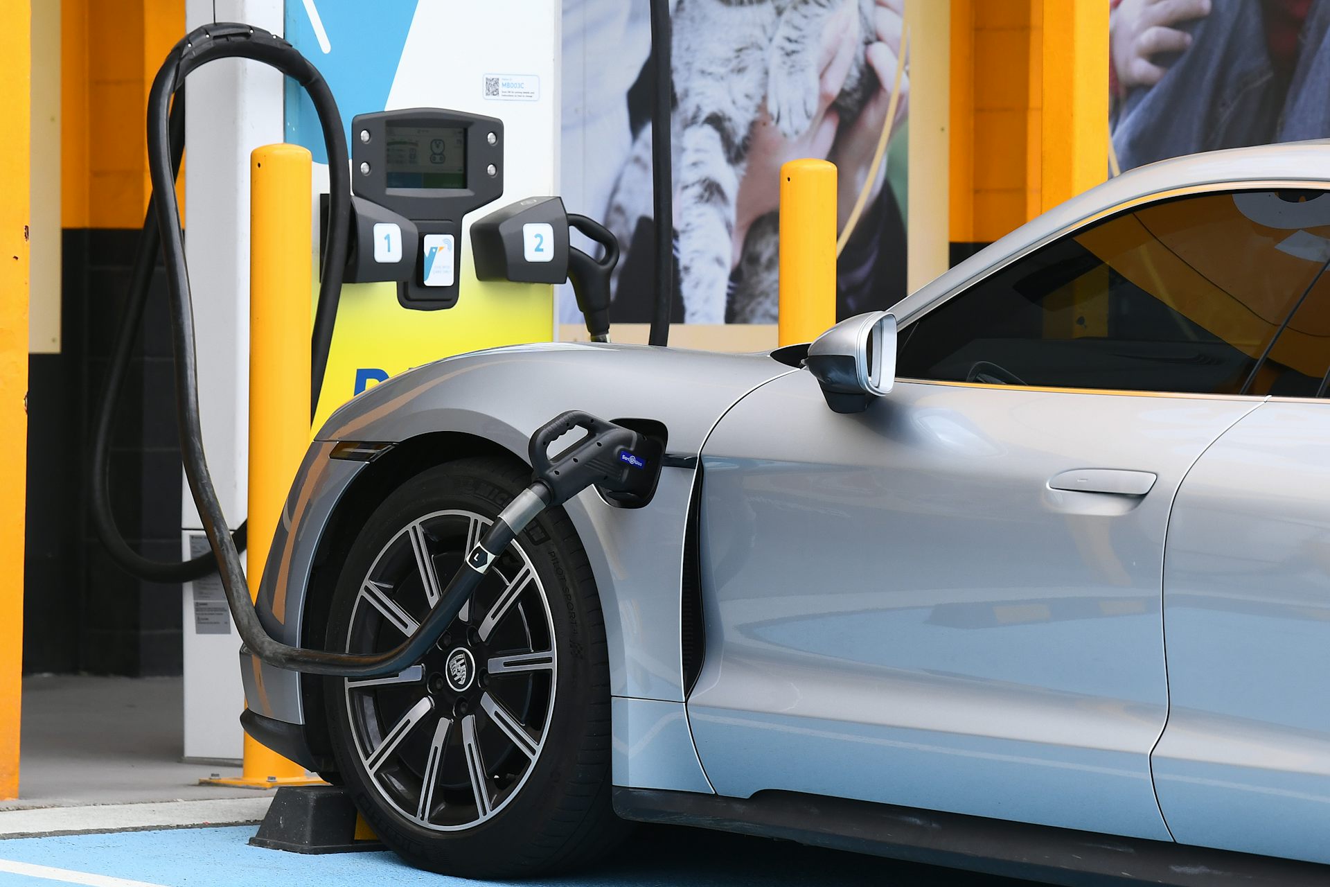 a silver EV being charged