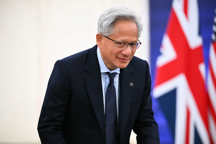 nvidia ceo jensen huang standing in front of a union flag while on a visit to the uk