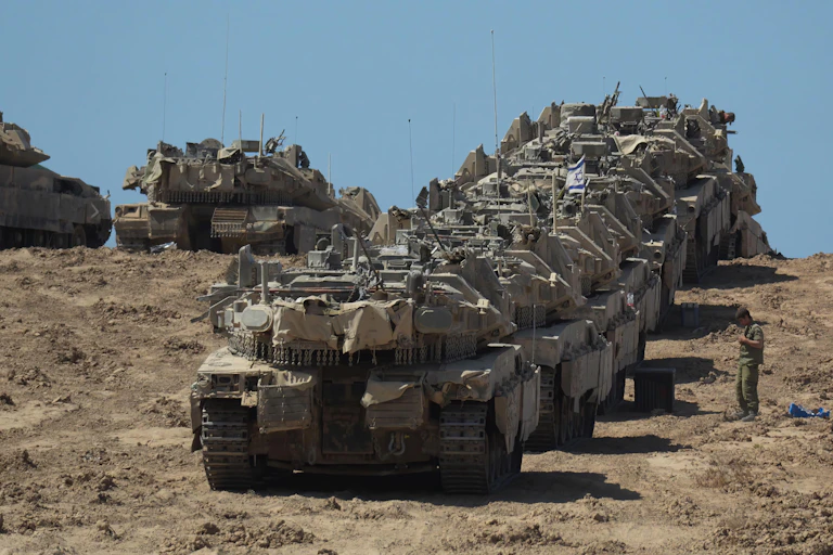 A line of Israeli tanks in formation.