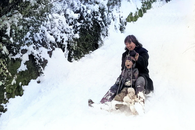 Mother and son playing in snow