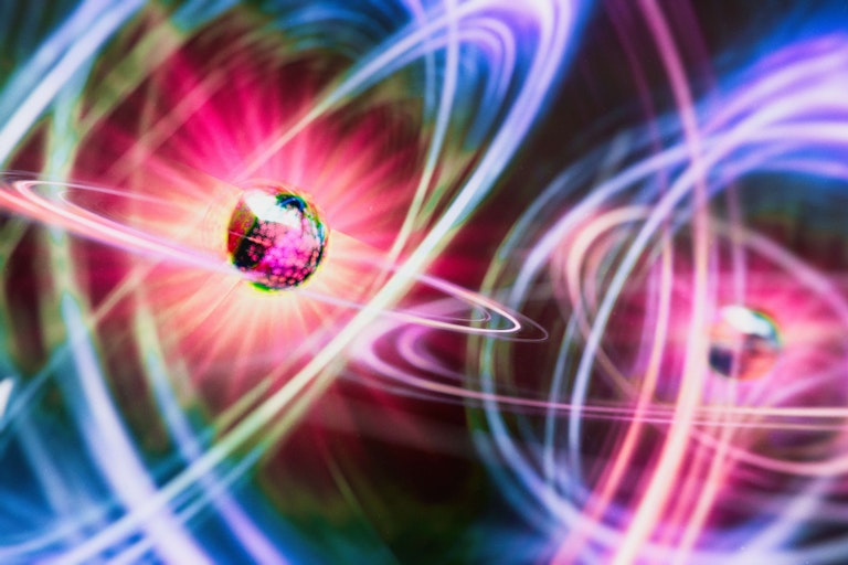 Two atoms surrounded by swirling electrons
