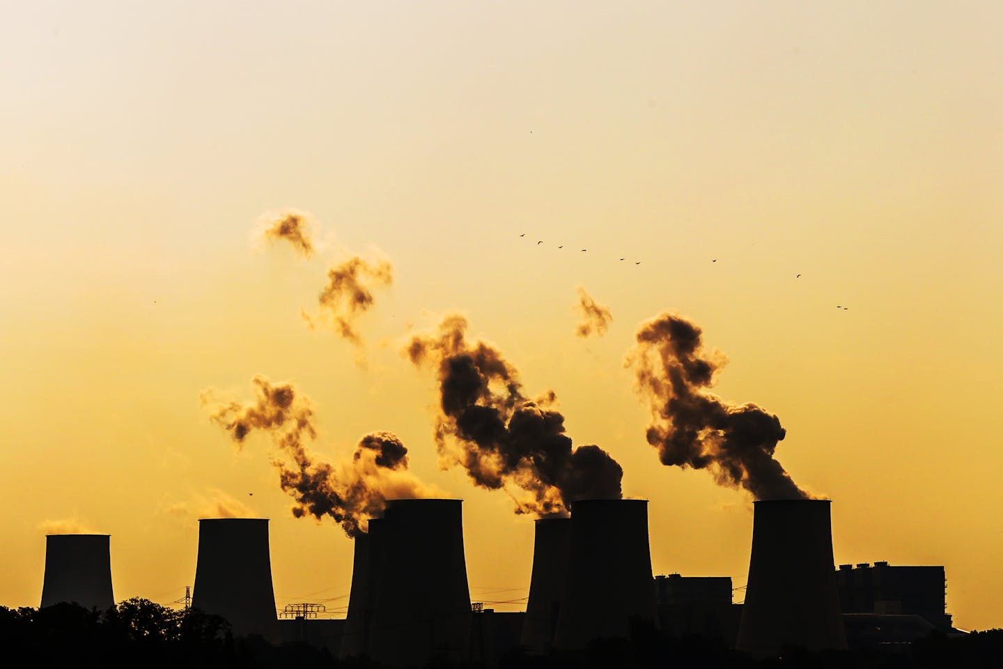 coal power station smokestacks belching smoke.