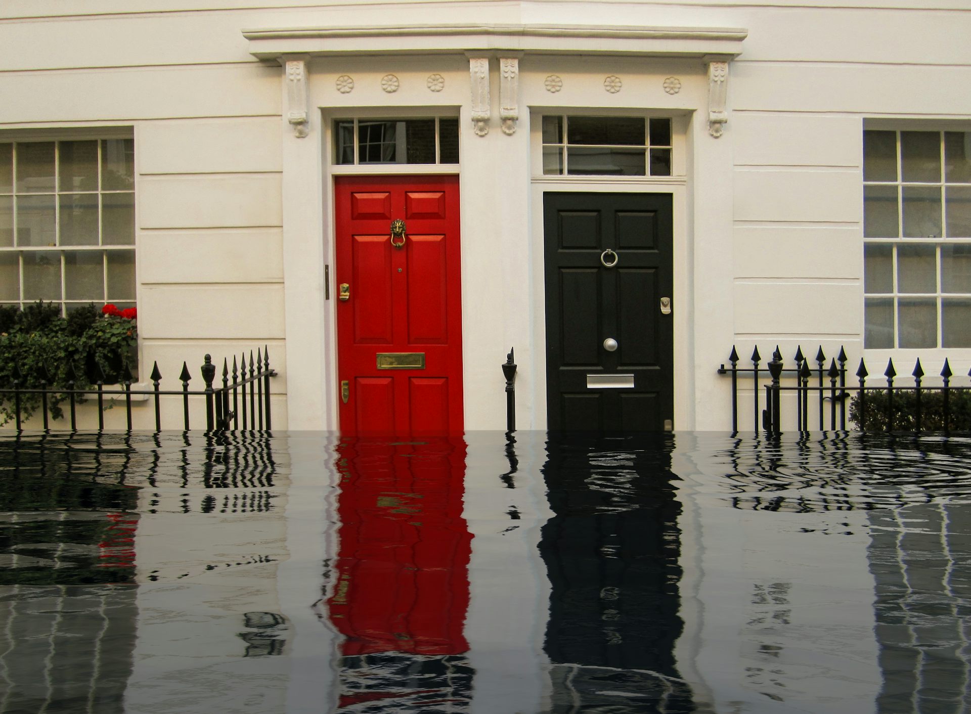 red and black front doors, exterior of homes with flooded street