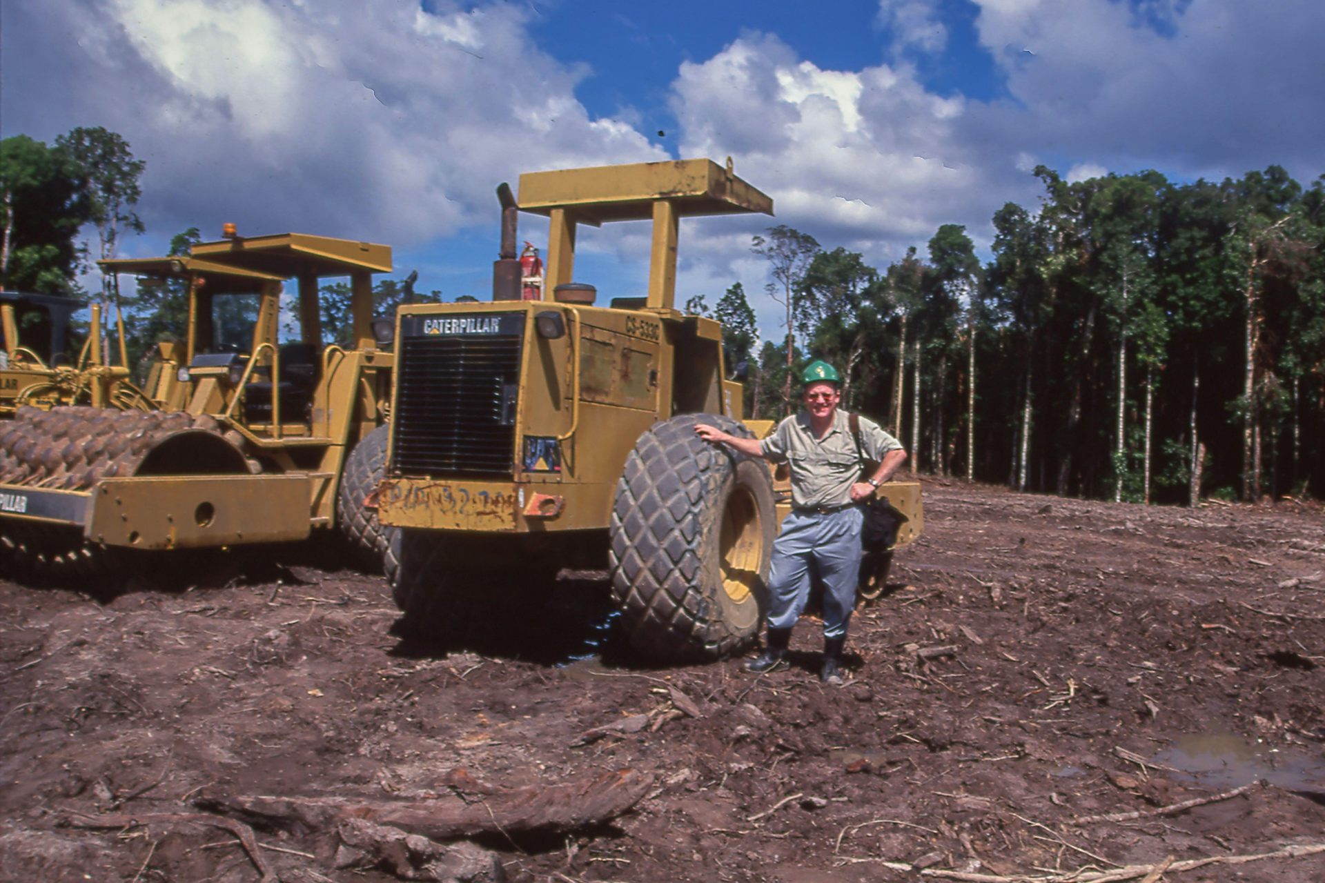 Man stands by tractor