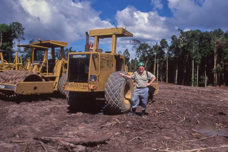 The alleged British hyperlinks to mass deforestation and displacement in a warfare few have even heard of 1 Man stands by tractor
