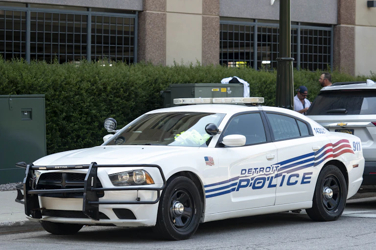 Detroit police car parked near sports venue