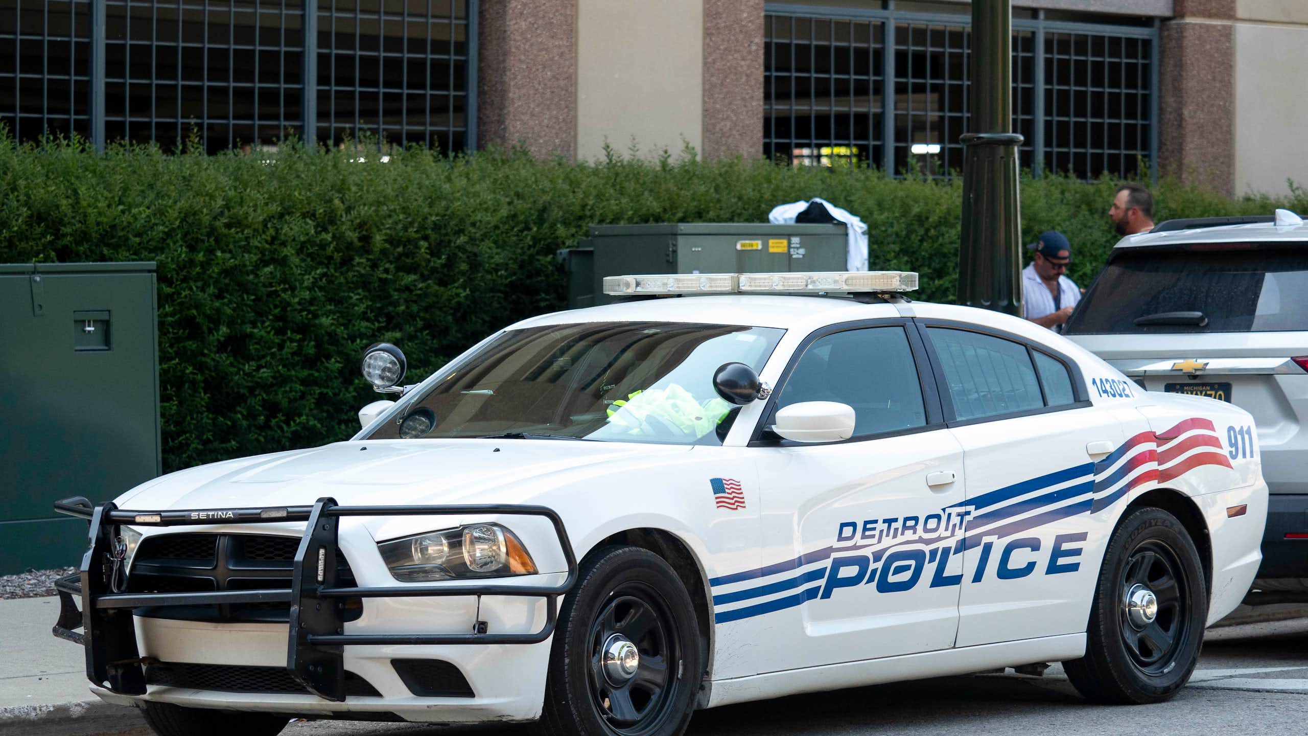 Detroit police car parked near sports venue